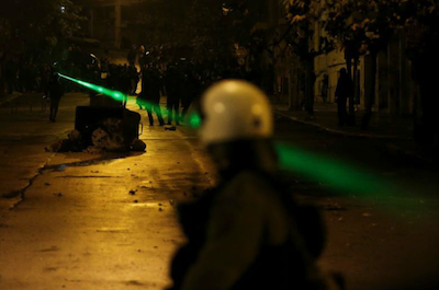 Greece protester laser beam police Nov 2017